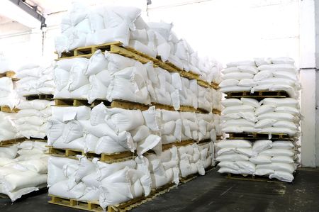 storehouse with stacked sacks of mealの写真素材