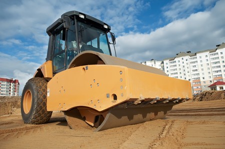 soil vibration roller during sand compacting works at construction site