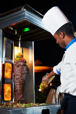 Arab chef making kebabの写真素材