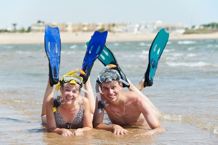 active couple at sea beach with snorkel  setの写真素材