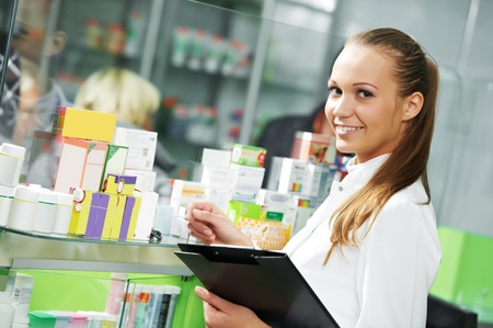 Pharmacy chemist woman in drugstoreの写真素材