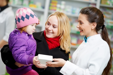 Pharmacy chemist, mother and child in drugstoreの写真素材