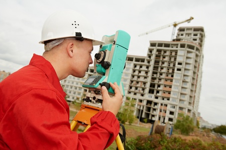 surveyor works with theodolite