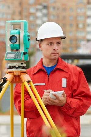 surveyor works with theodoliteの写真素材