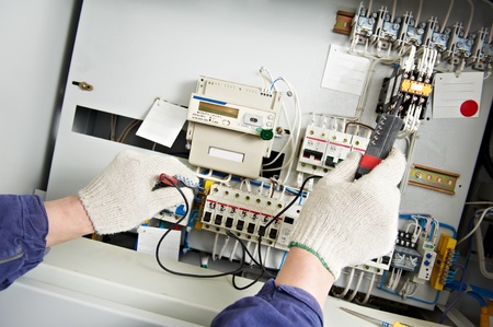 Close-up Hands of Electrician measure voltageの写真素材