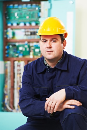 Electrician portrait over distribution power box