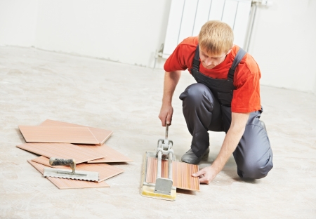 tiler cutting tile at home renovation workの写真素材