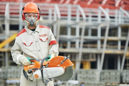 builder worker with disc cutterの写真素材
