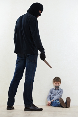 thief kidnapper with childの写真素材