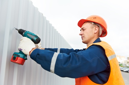 builder worker assembling metal construction