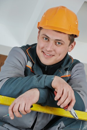 Happy young adult electrician builder engineer