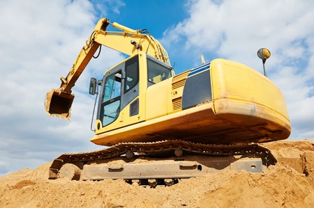 excavator machine at excavation earthmoving work in sand quarry
