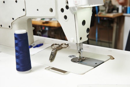 Tailor or sewing set with thread, scissors and machineの写真素材