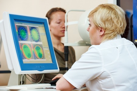 Optometry concept. female optometrist optician doctor evaluate eyesight of female patient in eye...