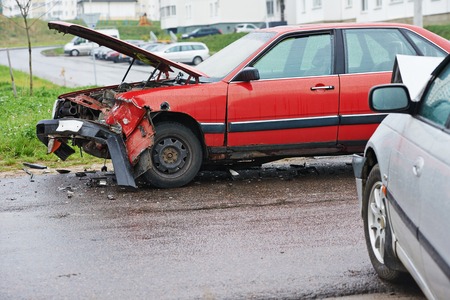 car crash accident on street, damaged automobiles after collision in cityの写真素材