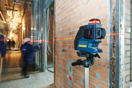 laser level equipment in measurement work at indoor construction siteの写真素材