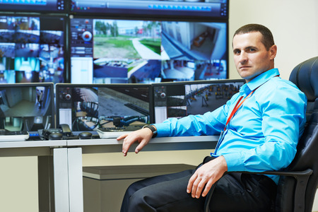 security guard watching video monitoring surveillance security system
