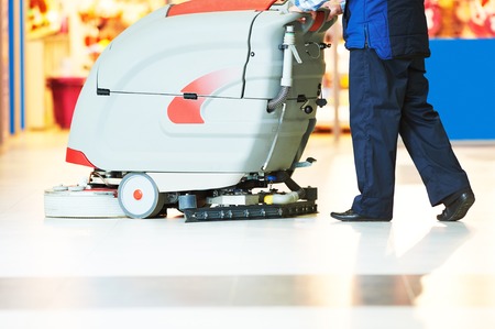 Floor care and cleaning services with washing machine in supermarket shop storeの写真素材