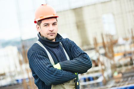 Male construction builder worker at building site
