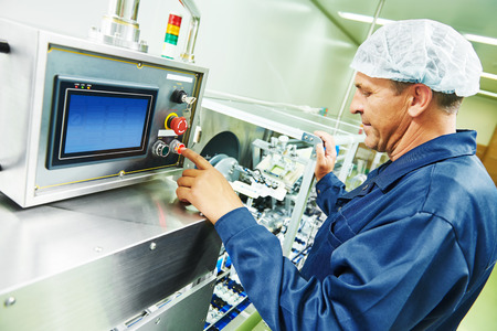 pharmaceutical factory man worker operating production line at pharmacy industry manufacture factory