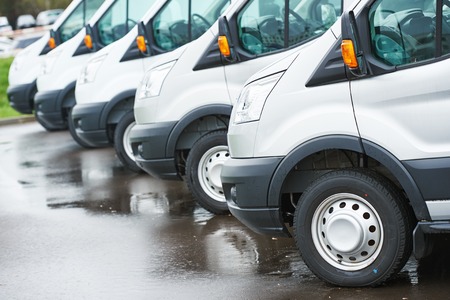freight services. commercial delivery vans in row at transporting carrier shipping service company...