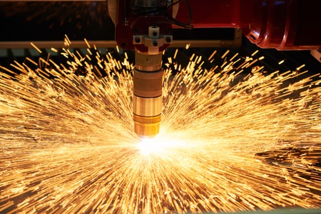 plasma or laser cutting metalworking. Technology of flat sheet metal steel material processing with...