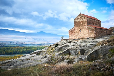 Uplistsikhe. Ancient rock cave city complex with christian basilica church in Georgiaの写真素材