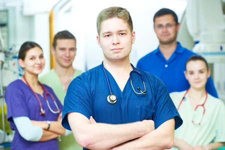 Hospital medic staff. Team of young surgeon doctors at operation room