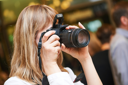 photographer woman at work indoorsの写真素材