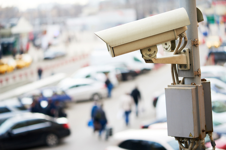 Urban safety and security. CCTV camera or surveillance operating in cityの写真素材