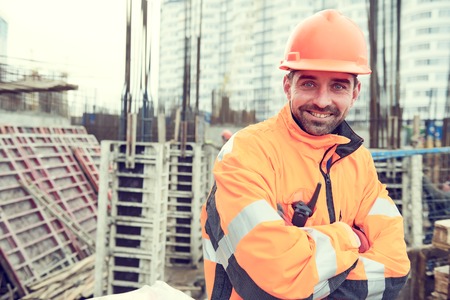 Happy builder worker at construction siteの写真素材