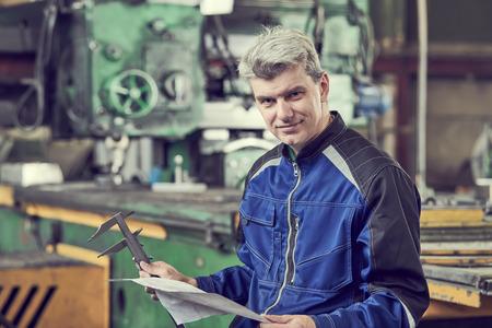 happy prouction engineer at factory