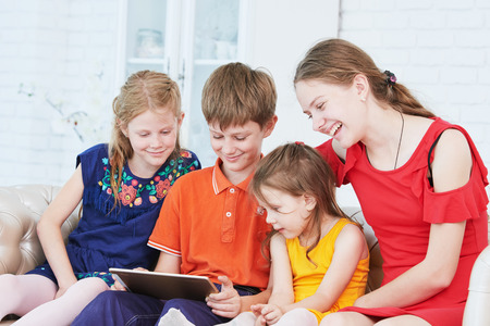 children playing on tablet computer