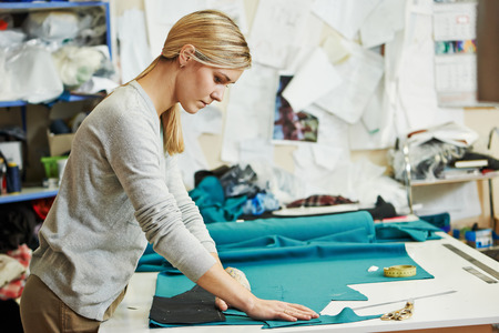 tailoring and sewing. Female tailor at workの写真素材