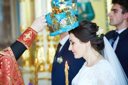 Groom and bride on the wedding ceremony in orthodox church