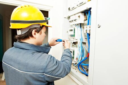 Electrician installing energy saving meter