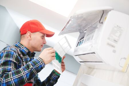 Air conditioner service. Check and replace the filter for cleaning