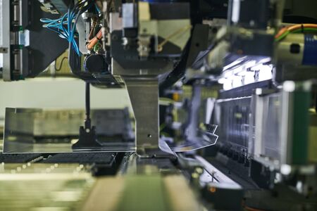 Panel bending machine at work. process of metal sheet forming
