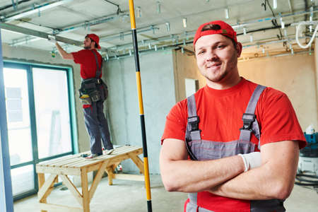 Gypsum plasterboard work. Drywall construction at home. Contractor worker