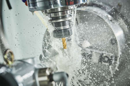 CNC milling machine work. metal processing with coolant