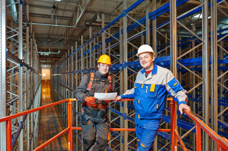 warehouse workers engineers in new modern storehouse