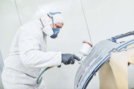 repairman painter in chamber painting automobile car bonnetの写真素材