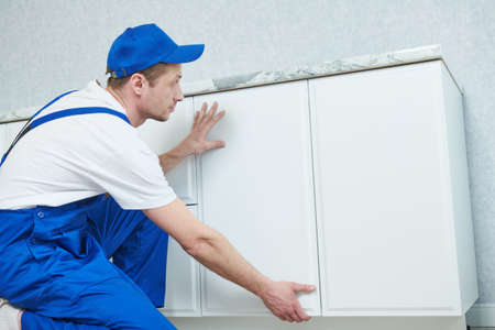 kitchen furniture set installation. hanging cabinetの写真素材