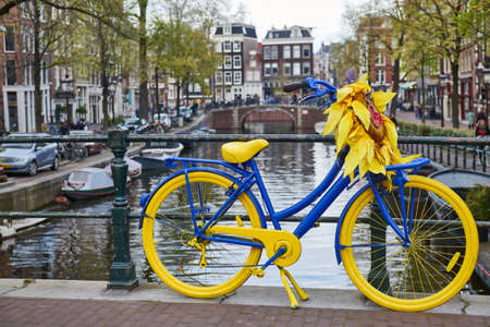 bike on amsterdam bridge street in cityの写真素材