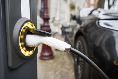 Electric Car Charging. Charger connector plugged to Electric autoの写真素材