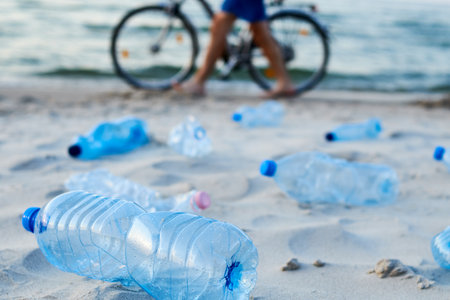Plastic bottles on sea beach. Environmental pollution by plastic wasteの写真素材
