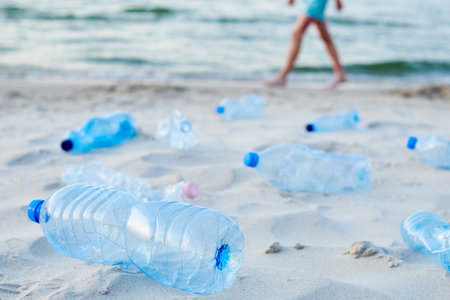 Plastic bottles on sea beach. Environmental pollution by plastic wasteの写真素材