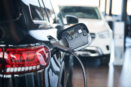 Electric Car Charging. Charger connector plugged to Electric autoの写真素材