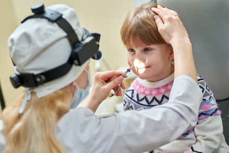 Eear Nose Throat medical examination of little girlの写真素材