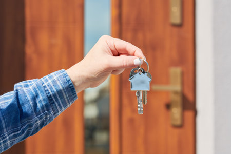 Hand with house keys. rent, purchase or sale real estateの写真素材